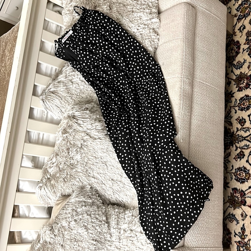 Black dress with white polka-dot sleeveless. Size 12.